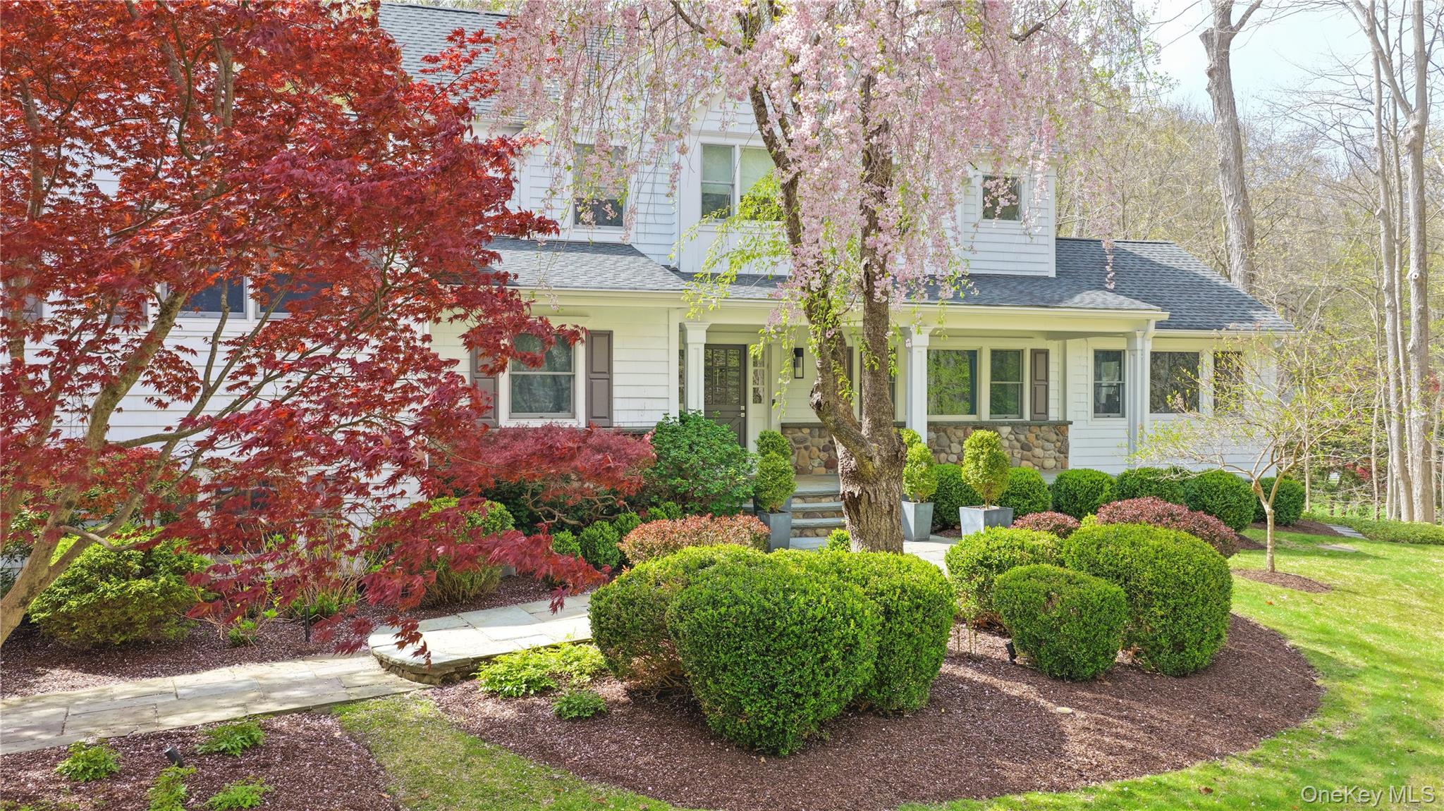 11 Thornewood Road Armonk, NY 10504 - Photo 4 of 35 a front view of a house with garden