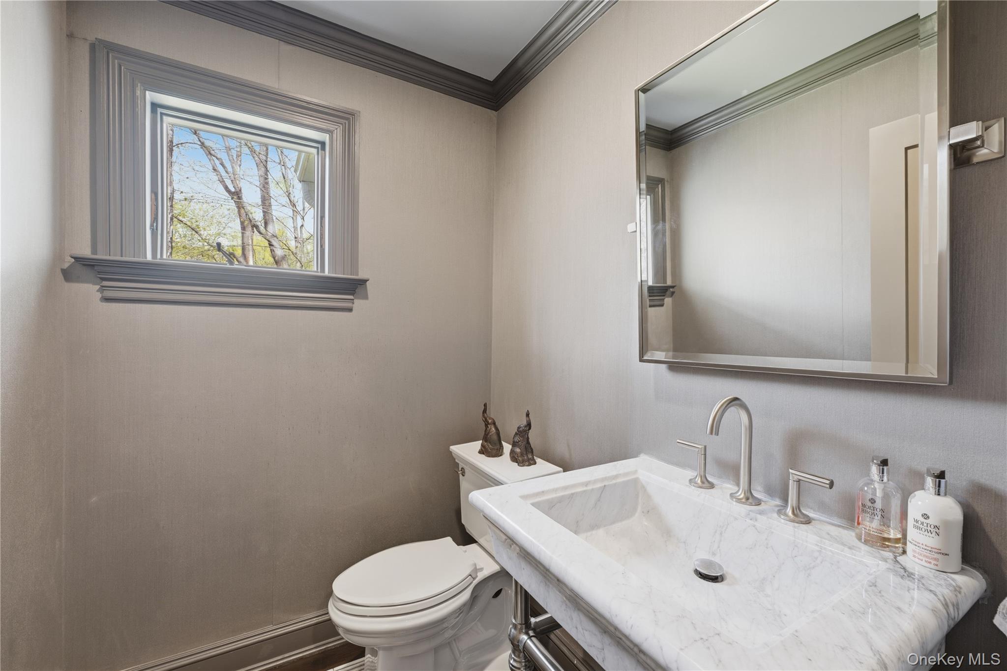 11 Thornewood Road Armonk, NY 10504 - Photo 9 of 35 a bathroom with a sink toilet and mirror