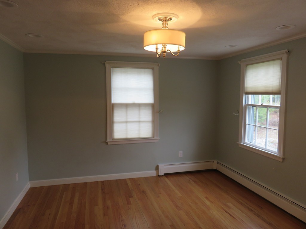 17 Juniper Road Weston, MA 02493 - Photo 20 of 30 an empty room with wooden floor and windows