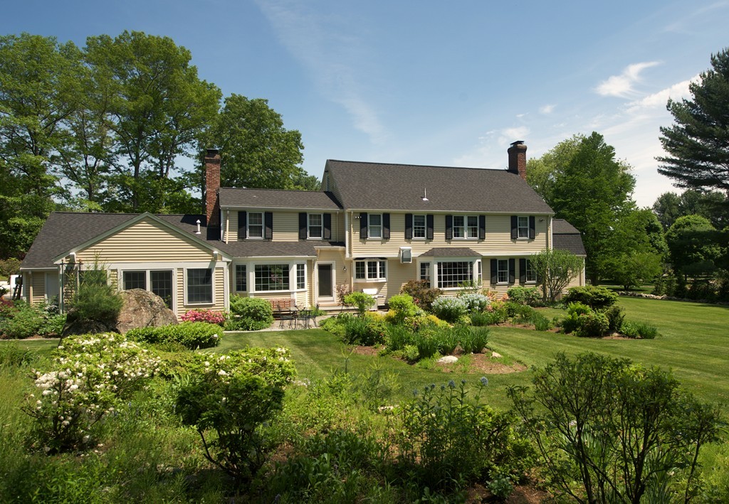 17 Juniper Road Weston, MA 02493 - Photo 2 of 30 a front view of a house with a yard