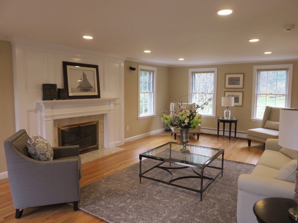 17 Juniper Road Weston, MA 02493 - Photo 5 of 30 a living room with furniture a fireplace and a potted plant