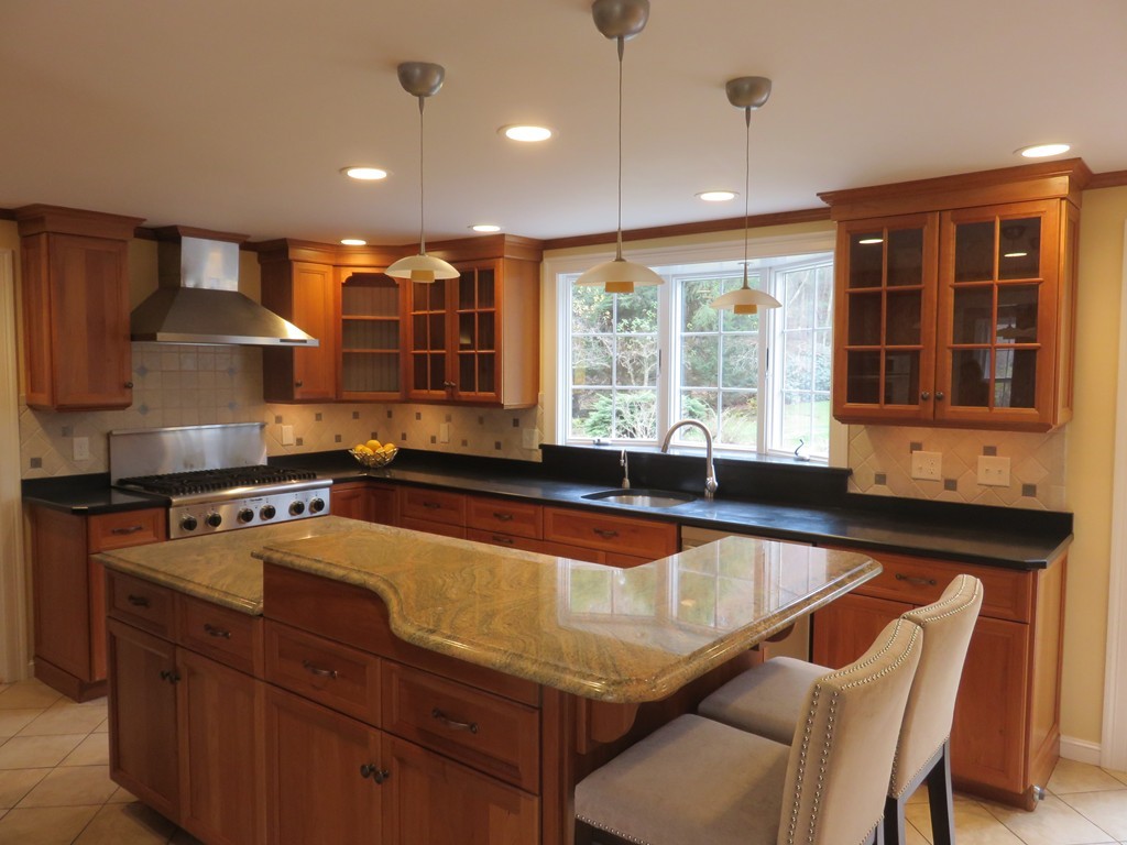 17 Juniper Road Weston, MA 02493 - Photo 8 of 30 a kitchen with a sink stove and cabinets