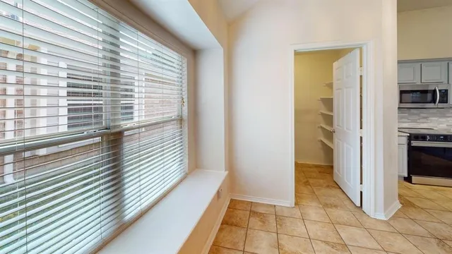 a view of a kitchen from the hallway
