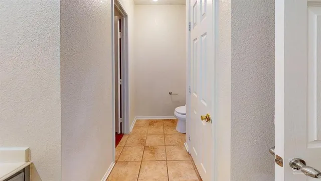a view of a bathroom from the hallway