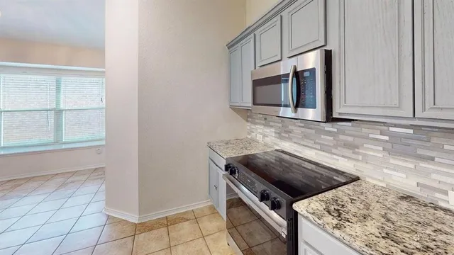 a view of a hallway with a wooden cabinets