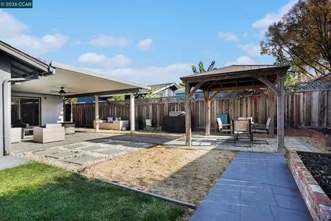 a view of a dinning table and chairs in patio