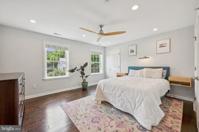 a spacious bedroom with a large bed and a window