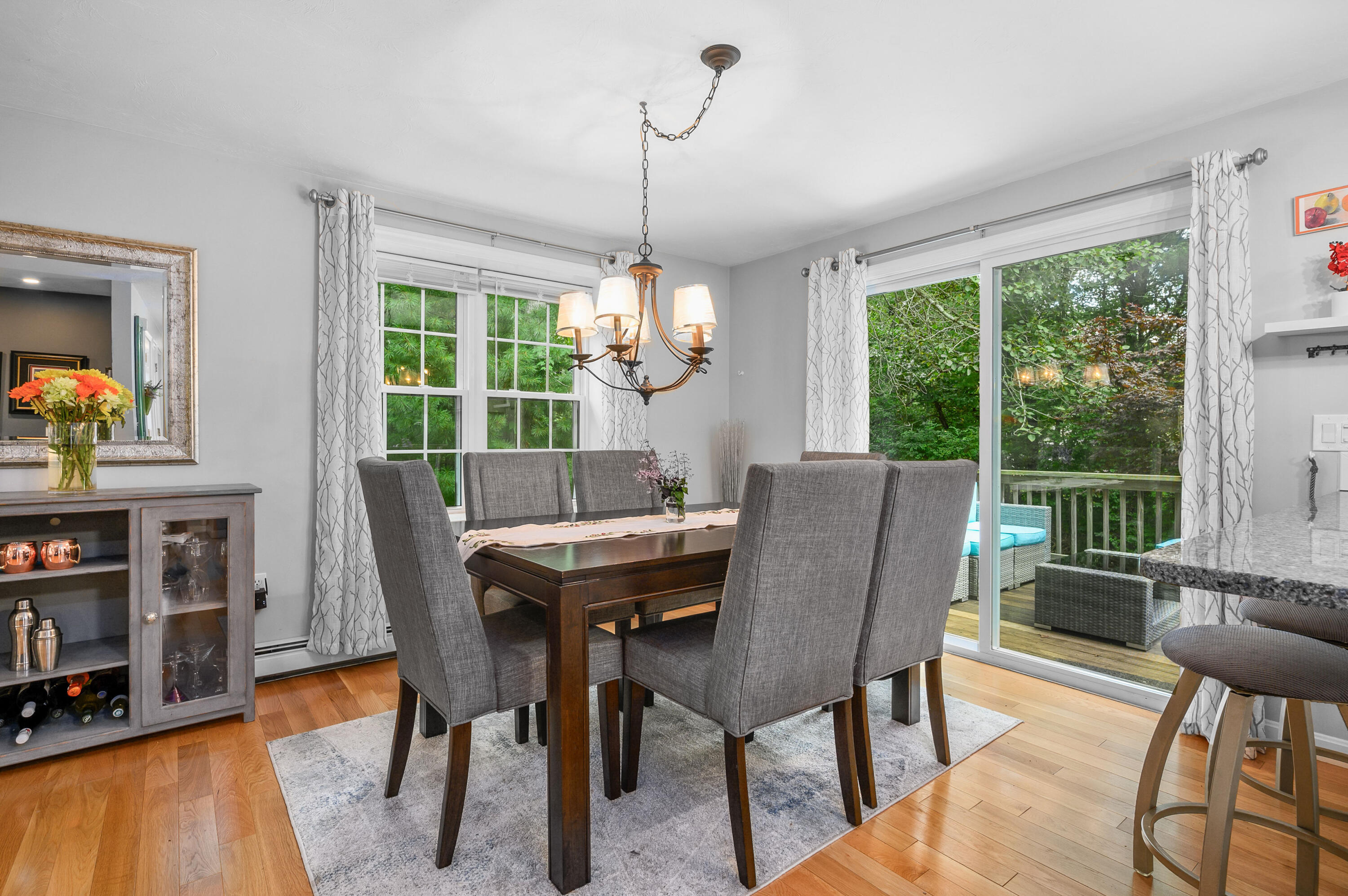 4 Santuit Lane Mashpee, MA 02649 - Photo 13 of 36 a view of a dining room with furniture window and wooden floor