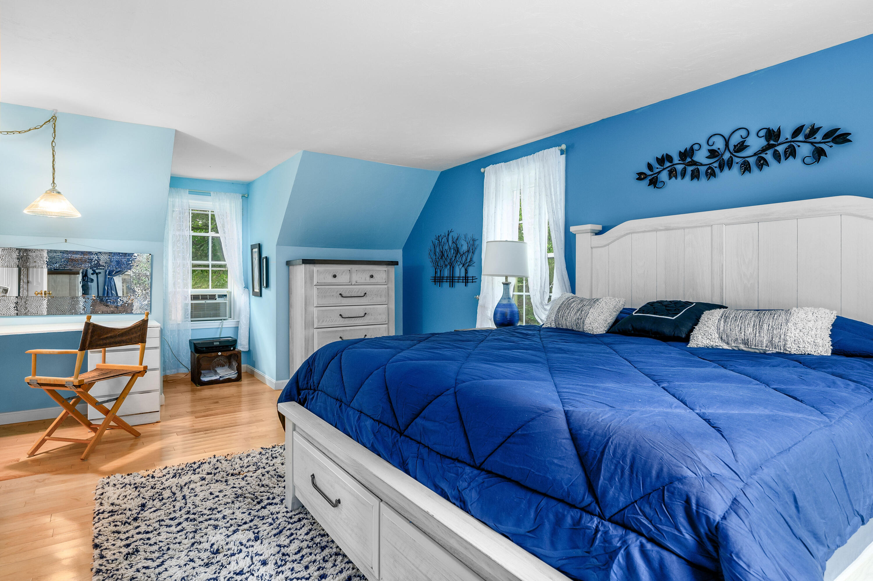 4 Santuit Lane Mashpee, MA 02649 - Photo 20 of 36 a bedroom with a large bed a table and chair