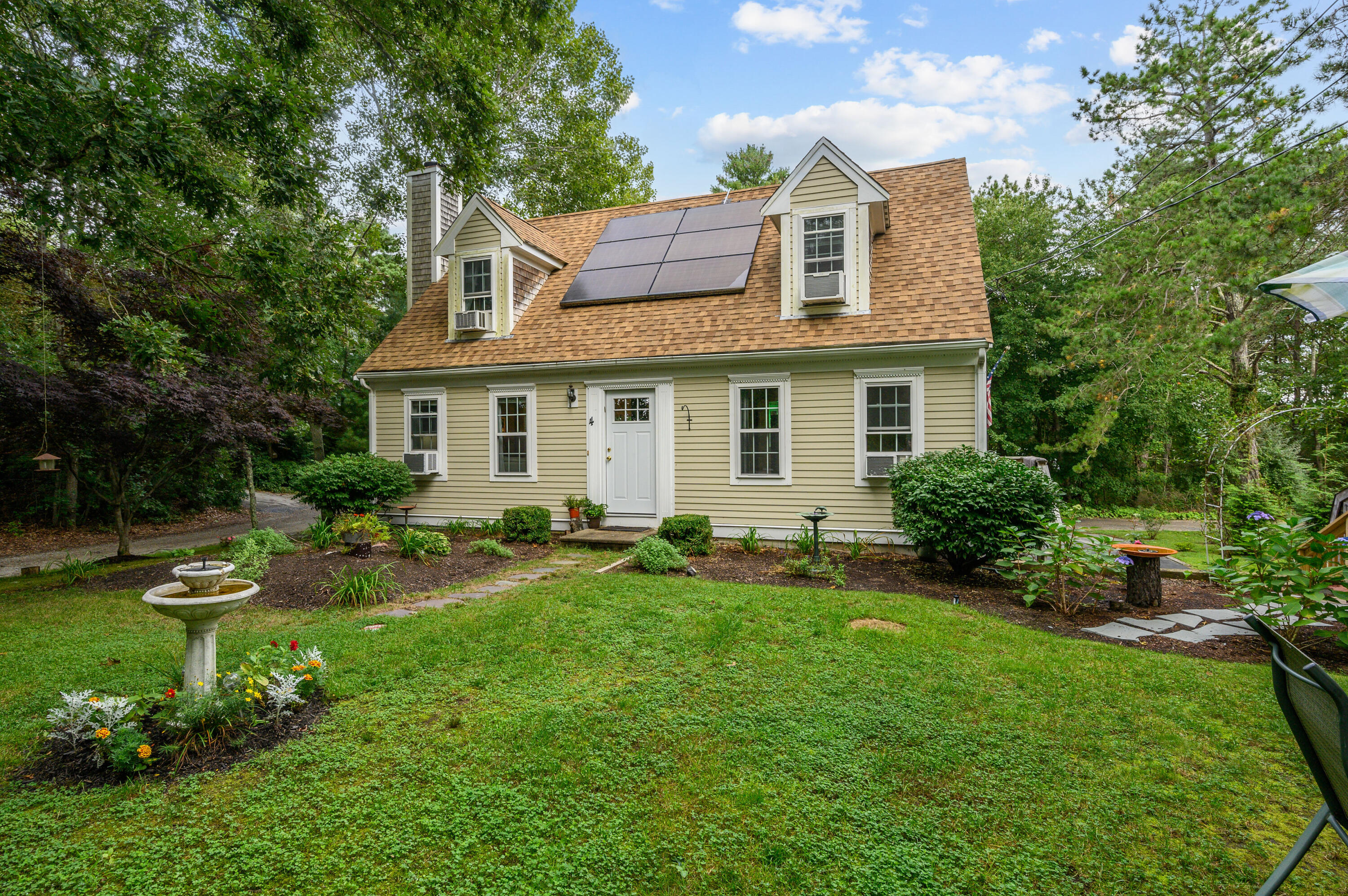 4 Santuit Lane Mashpee, MA 02649 - Photo 2 of 36 a view of a house with a yard and sitting area
