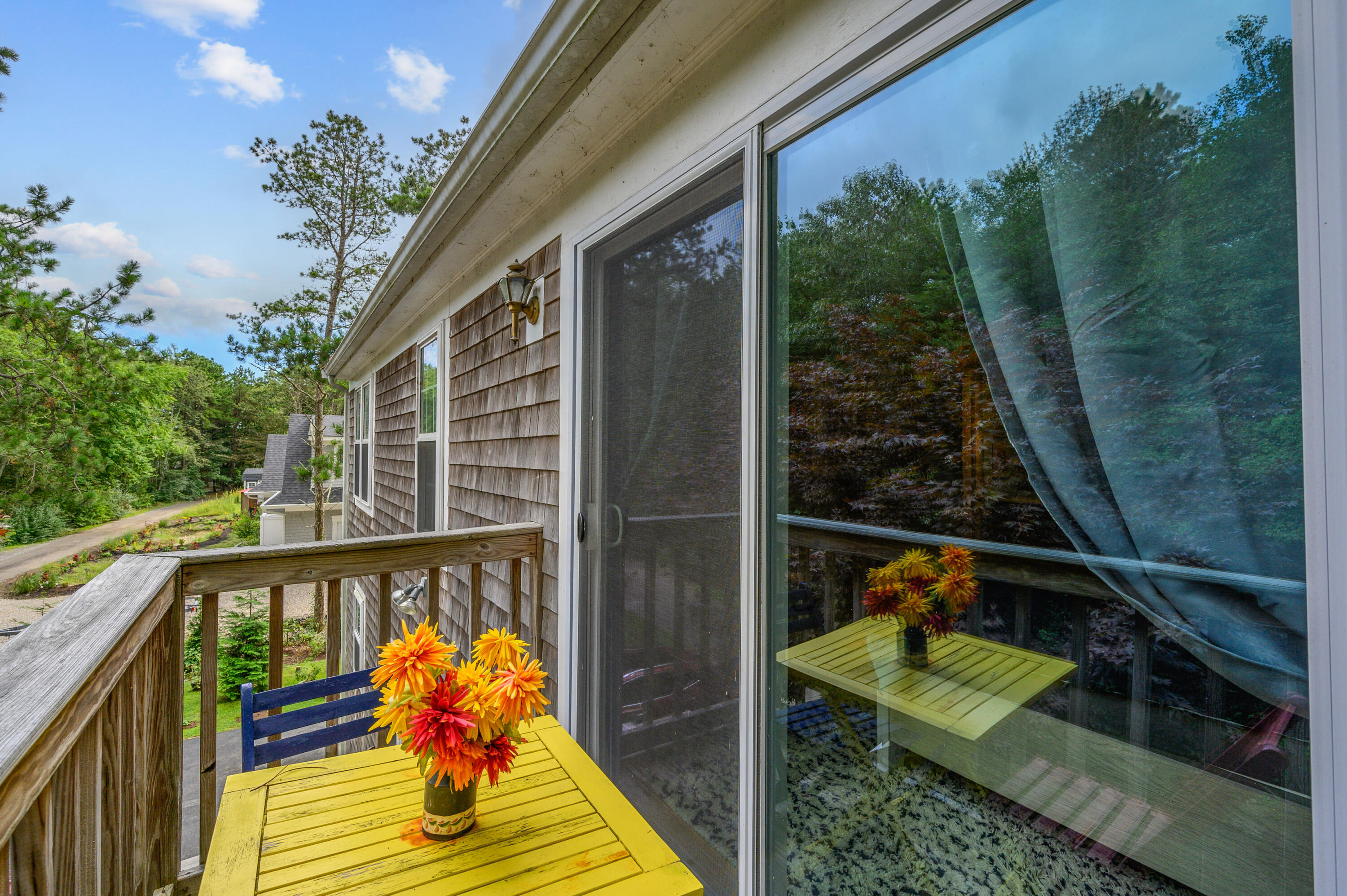 4 Santuit Lane Mashpee, MA 02649 - Photo 22 of 36 a balcony view with two chairs and a potted plant