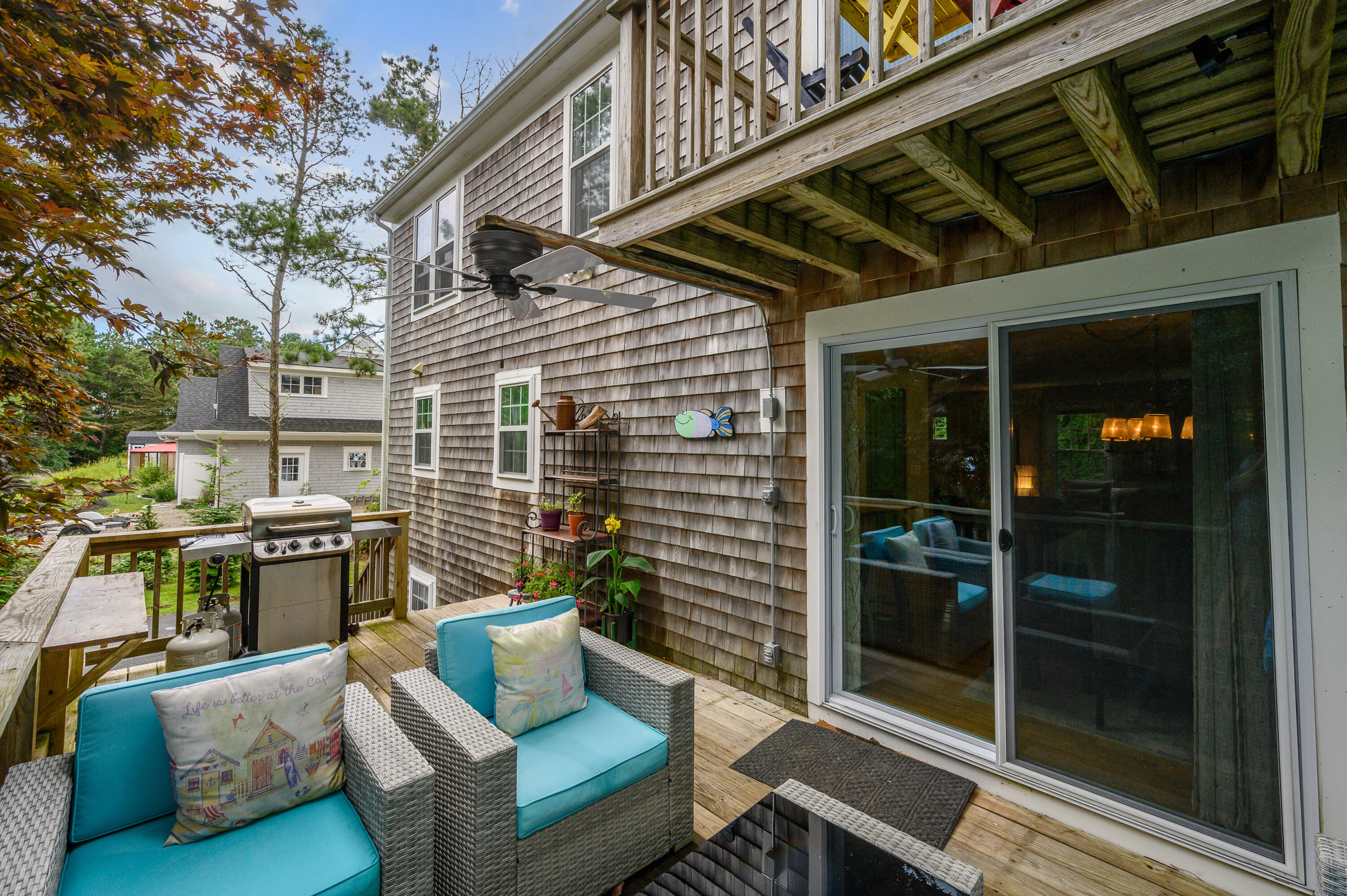 4 Santuit Lane Mashpee, MA 02649 - Photo 29 of 36 a view of a patio with couches chairs and wooden floor