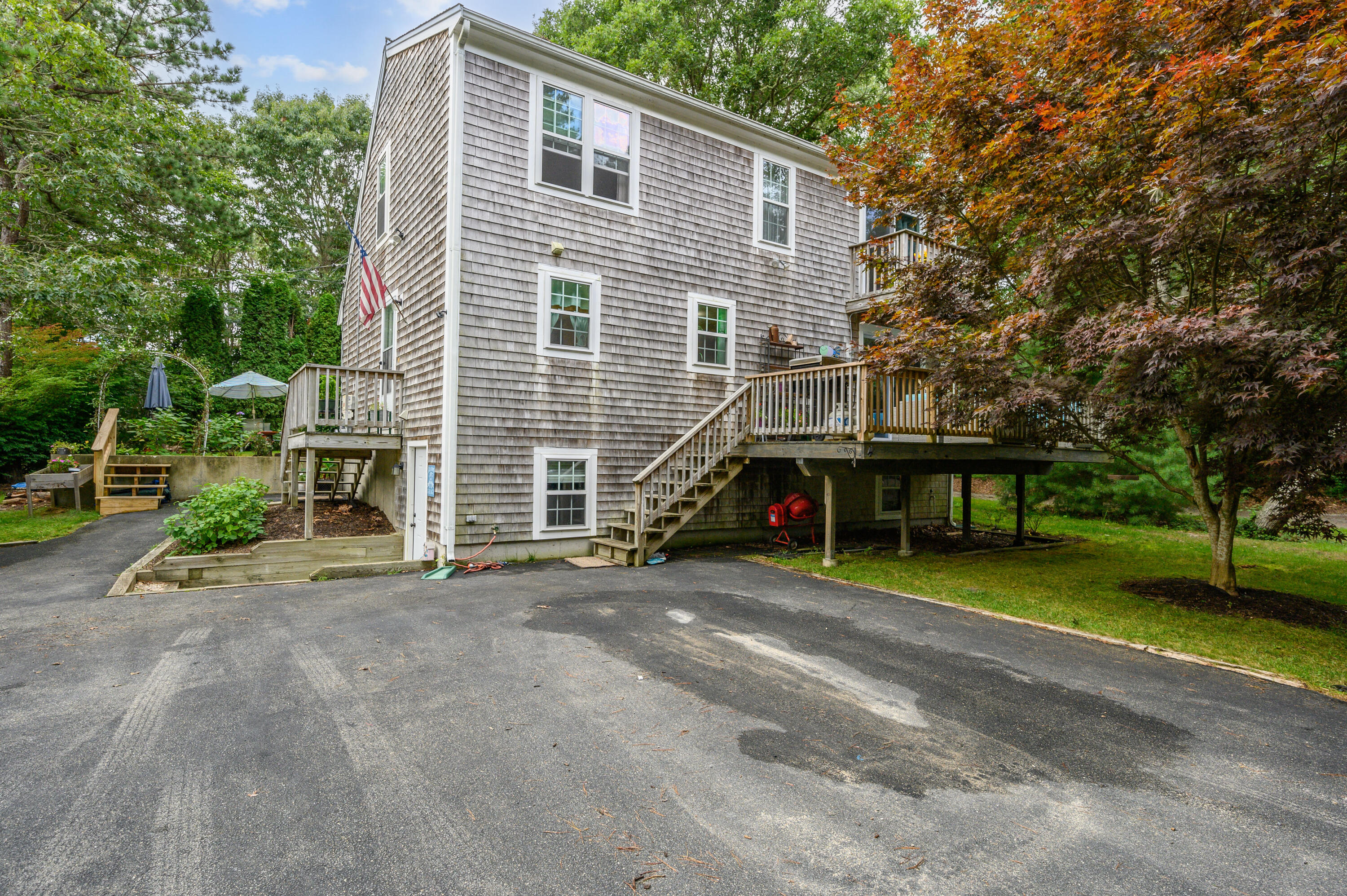 4 Santuit Lane Mashpee, MA 02649 - Photo 35 of 36 a view of a house with backyard and trees