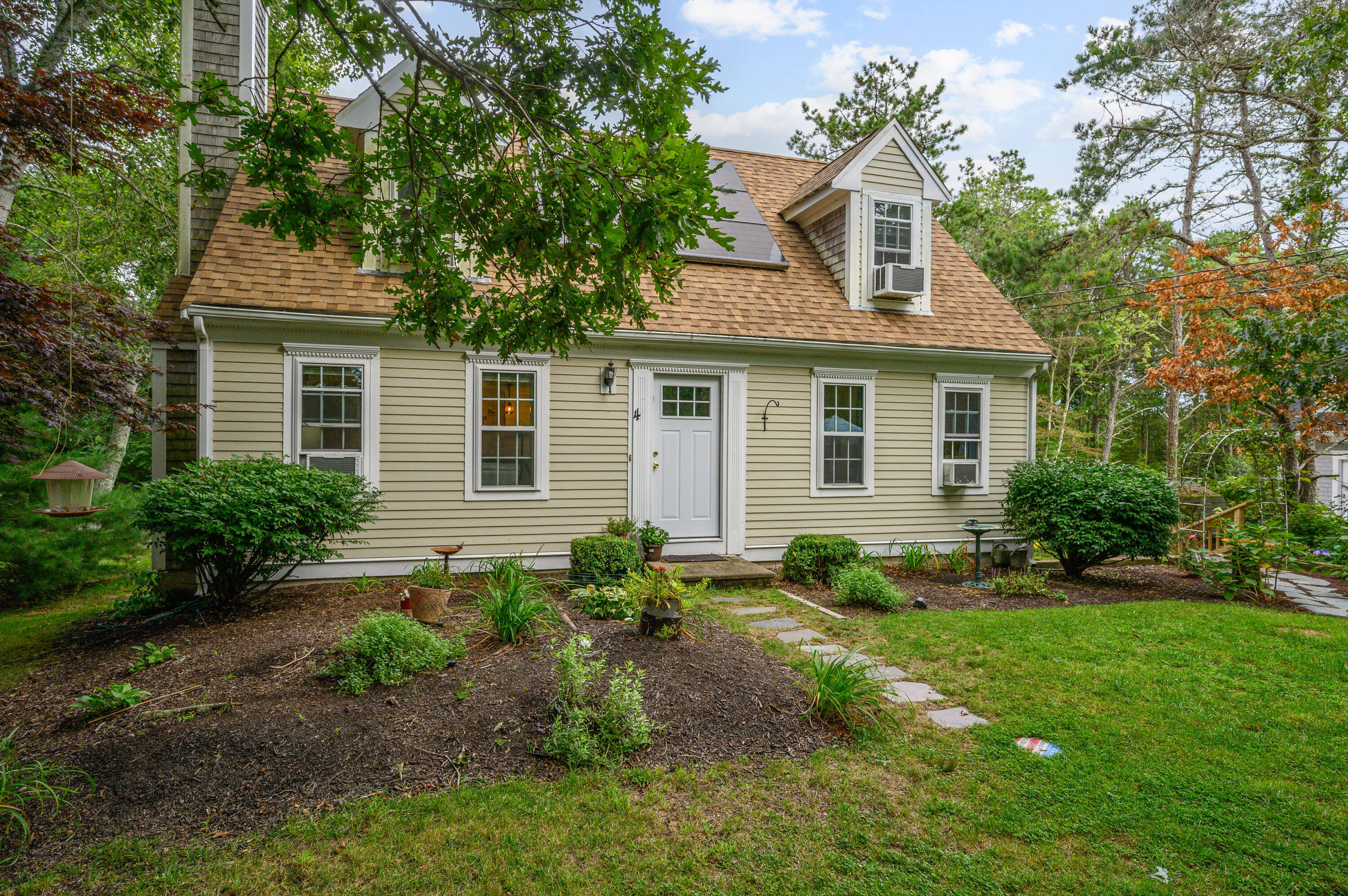 4 Santuit Lane Mashpee, MA 02649 - Photo 36 of 36 a front view of a house with garden