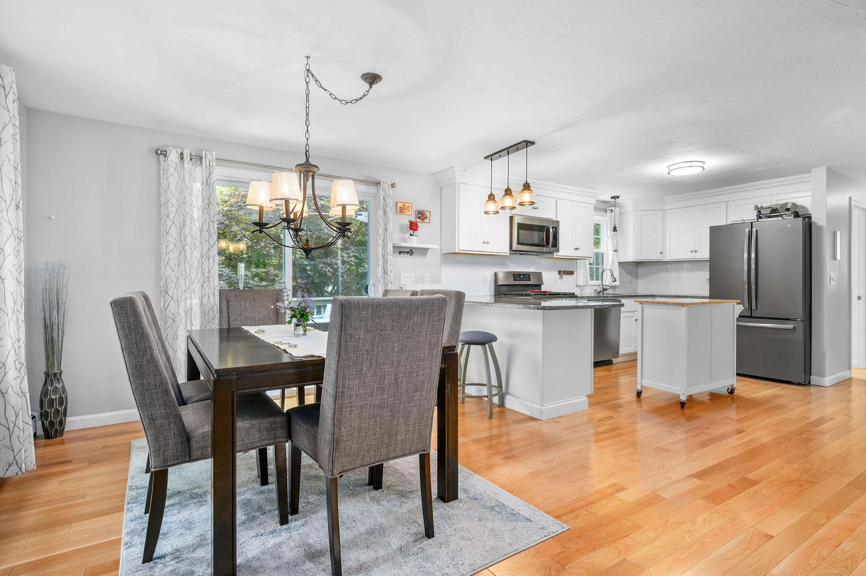 4 Santuit Lane Mashpee, MA 02649 - Photo 10 of 36 a dining room filled kitchen with a table chairs and entryway