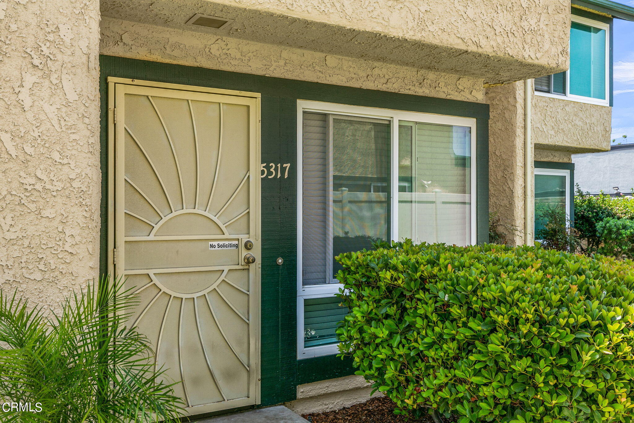 5317 Perkins Road Oxnard, CA 93033 - Photo 5 of 10 a front view of a house with a garden