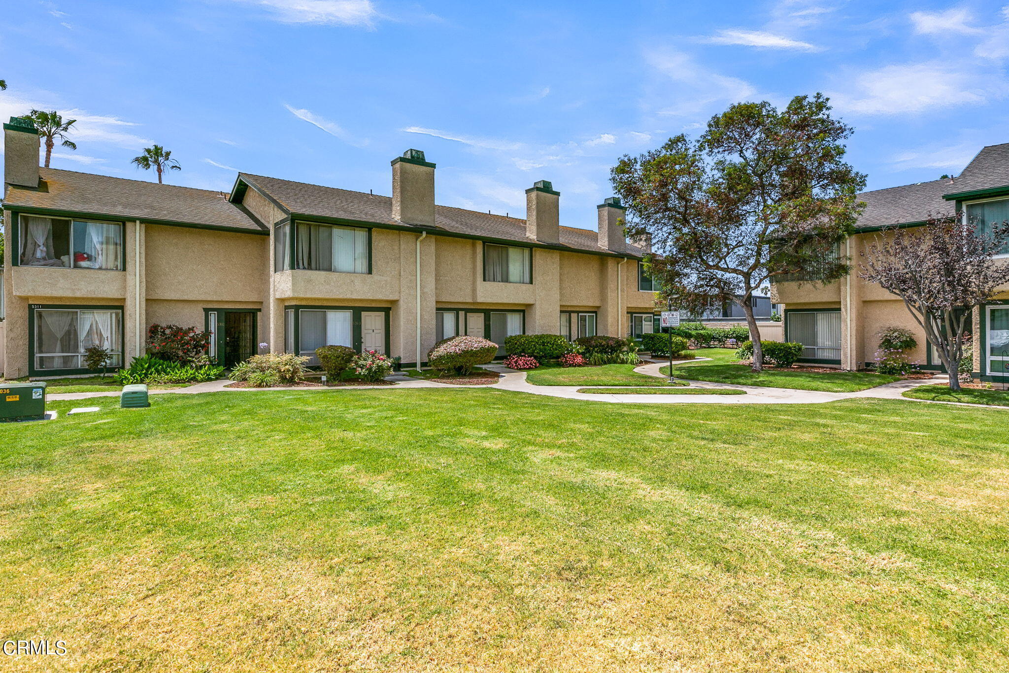 5317 Perkins Road Oxnard, CA 93033 - Photo 7 of 10 a front view of a building with a garden