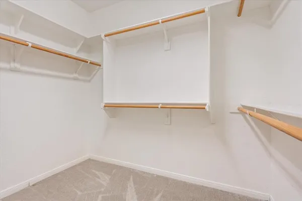 a view of an empty walk in closet