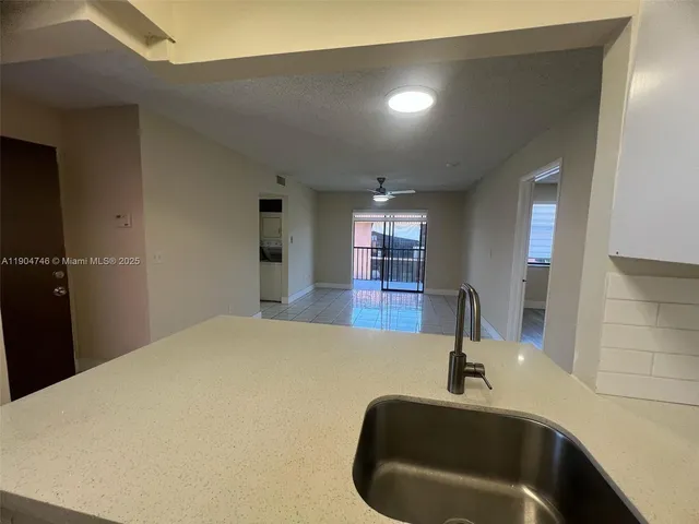a bathroom with a sink and a large mirror