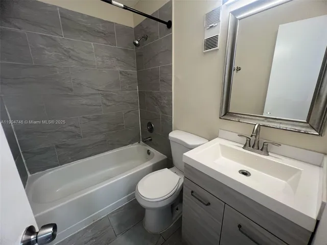 a bathroom with a sink a toilet and a bathtub
