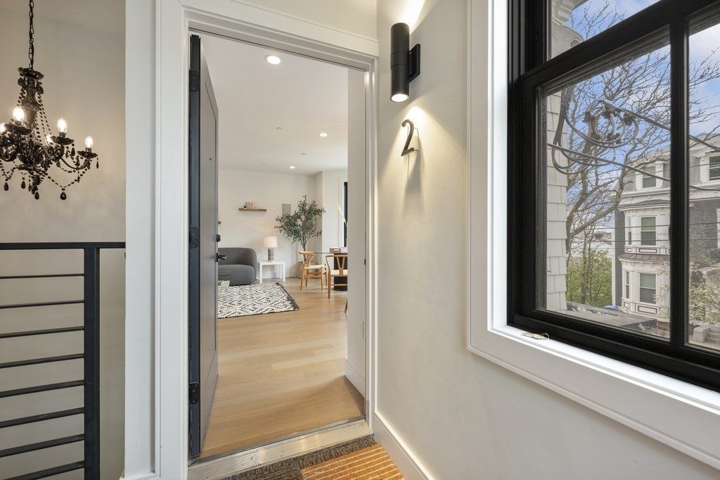 228 Webster Street, Unit 2 Boston, MA 02128 - Photo 27 of 32 a view of a hallway with a living room