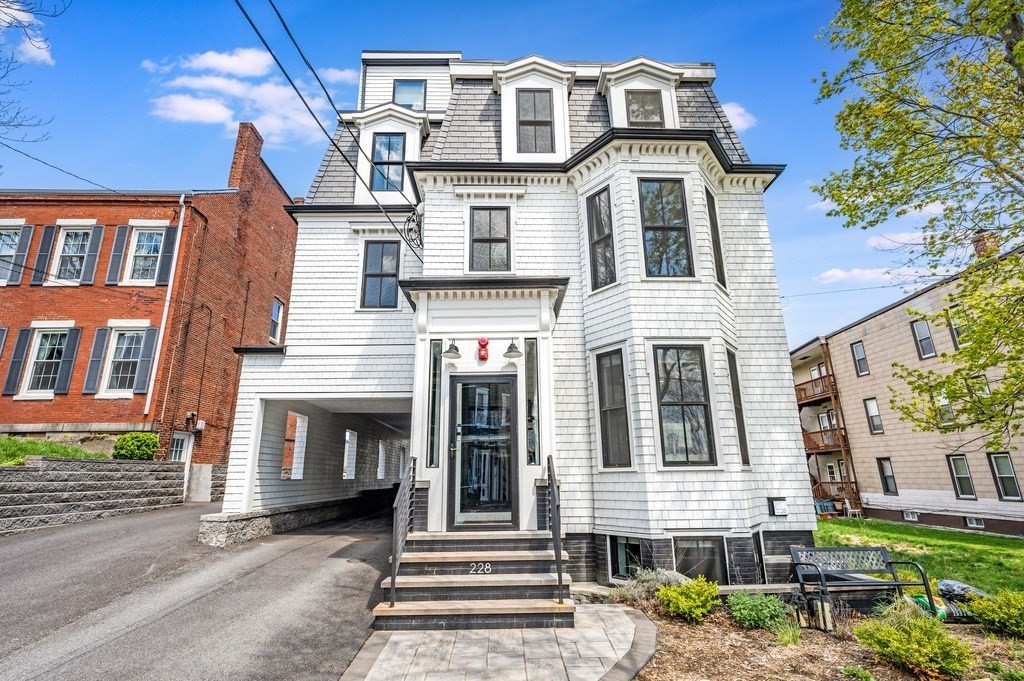 228 Webster Street, Unit 2 Boston, MA 02128 - Photo 29 of 32 a front view of a house with a yard