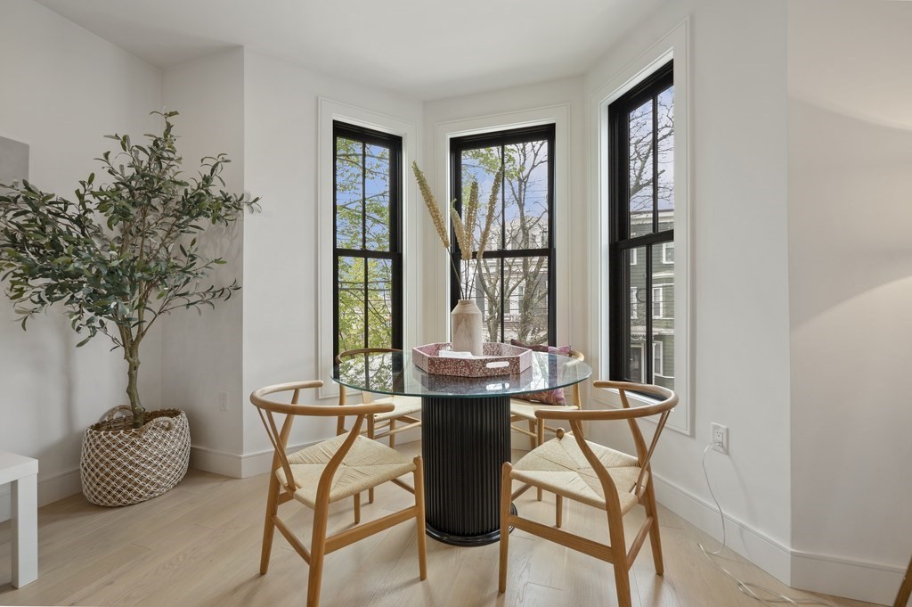 228 Webster Street, Unit 2 Boston, MA 02128 - Photo 7 of 32 a room with a table and chairs