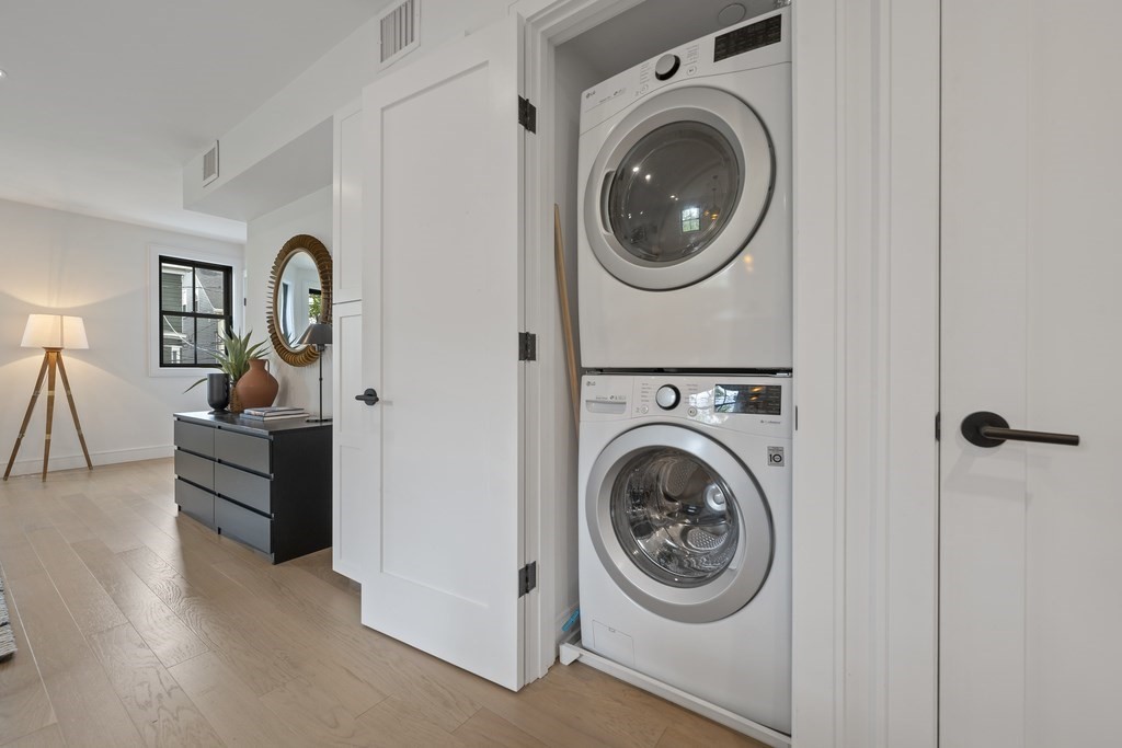 228 Webster Street, Unit 2 Boston, MA 02128 - Photo 9 of 32 a utility room with dryer washer and a view of bathroom