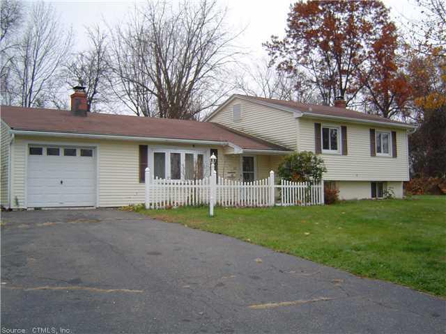 20 Craigmore Road Bloomfield, CT 06002 - Photo 1 of 1 a front view of a house with a garden