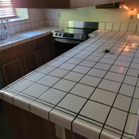 a kitchen with a sink and cabinets