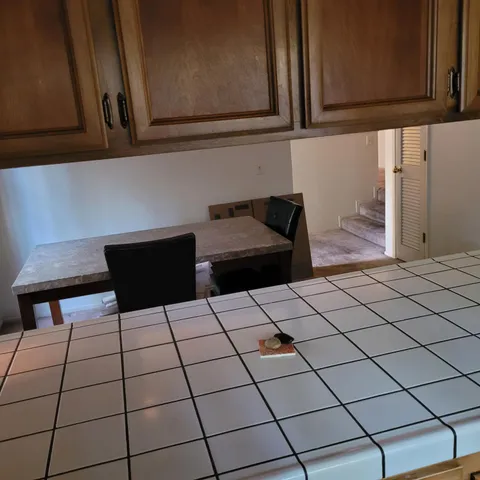 a kitchen with a sink and cabinets