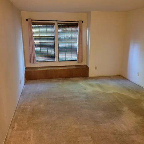 a bathroom with a toilet and shower