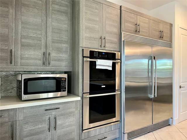 a bathroom with a sink mirror and toilet