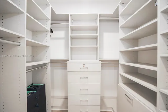 a bathroom with a double vanity sink mirror and shower
