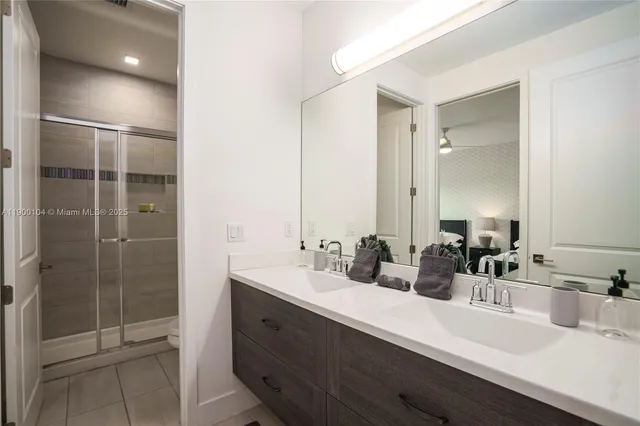 a view of a backyard with a slide trees and wooden fence