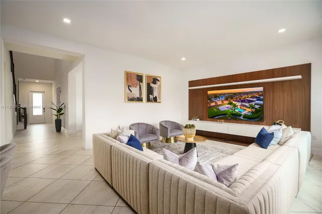 a large kitchen with granite countertop a large counter top stainless steel appliances and cabinets