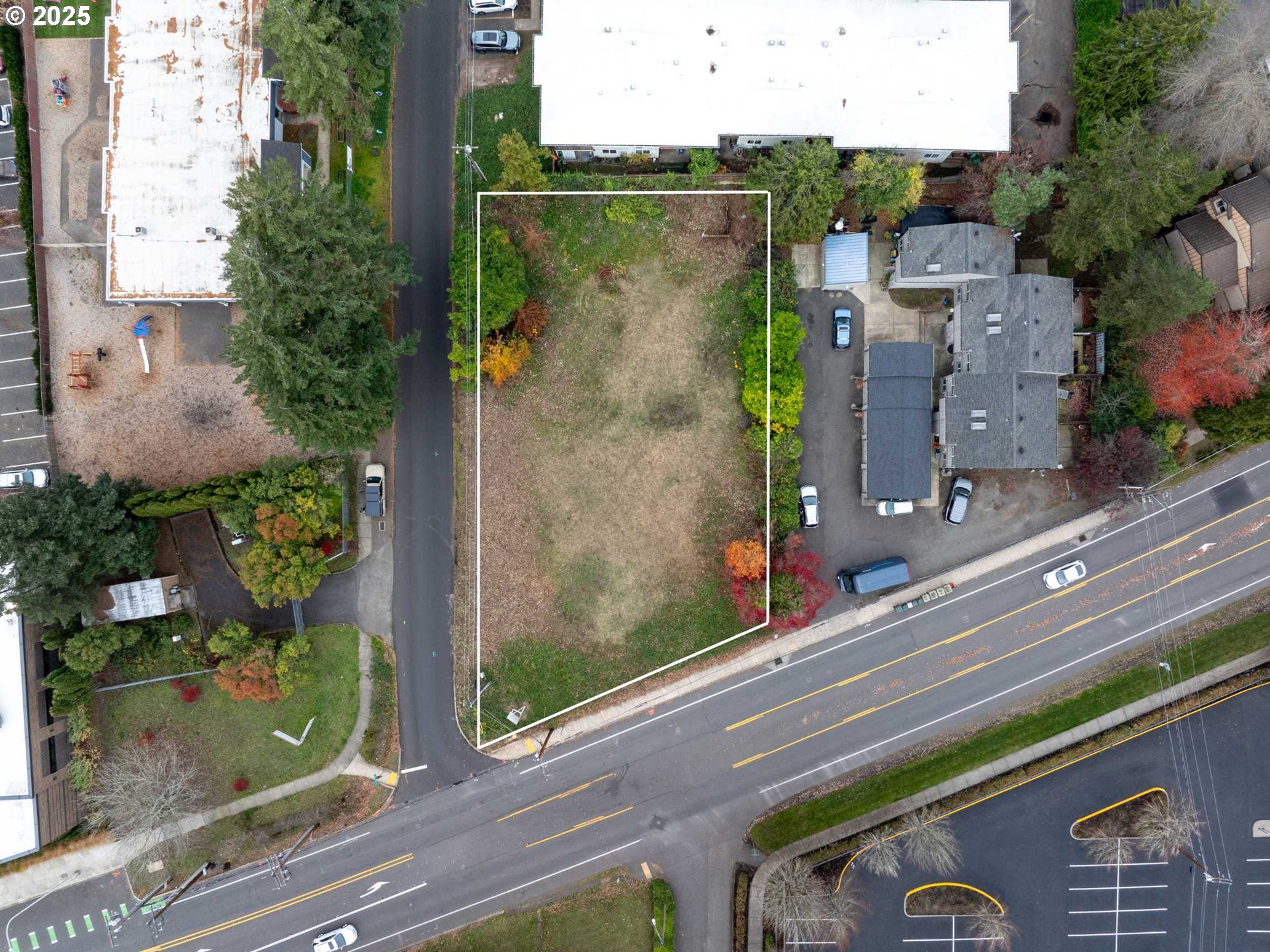 an aerial view of a house with a yard