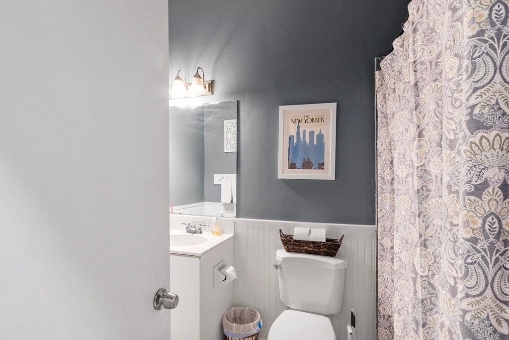 787 East 3rd Street, Unit 2 Boston, MA 02127 - Photo 11 of 15 a bathroom with a toilet sink and mirror