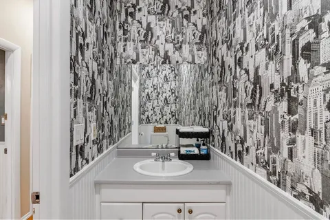 a bathroom with a sink and a mirror