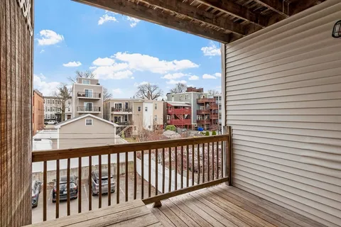 a view of a balcony with city view