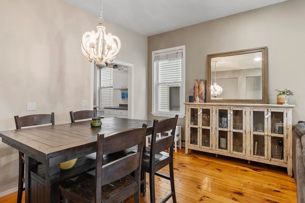 787 East 3rd Street, Unit 2 Boston, MA 02127 - Photo 6 of 15 a view of a dining room with furniture wooden floor and chandelier