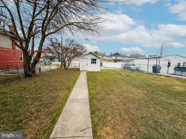a view of swimming pool with a yard