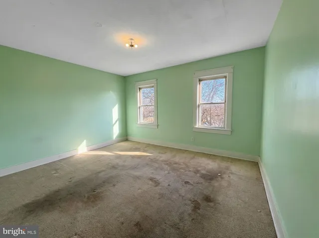 an empty room with windows