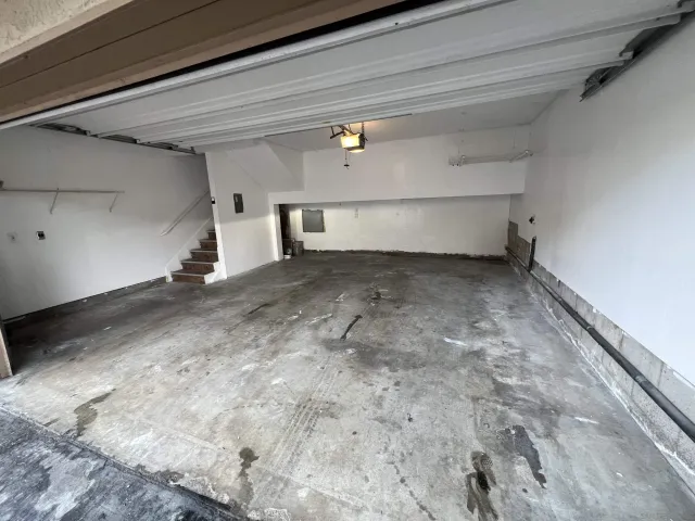 a front view of a house with garage