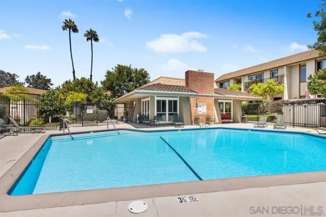 a front view of house with yard swimming pool and outdoor seating