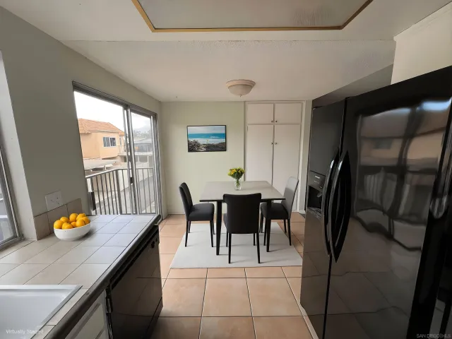 a dining room with furniture and window