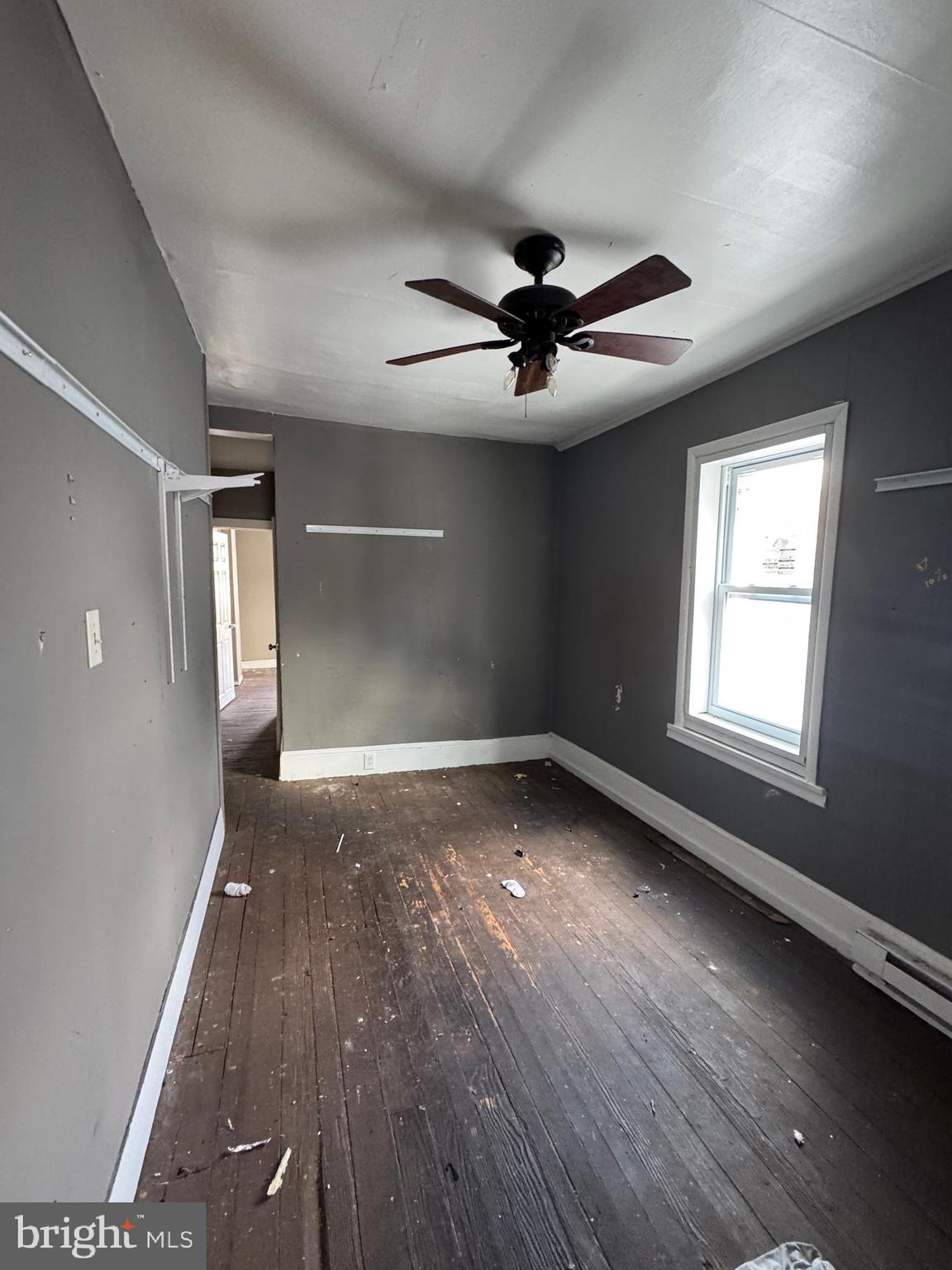 401 Walnut Street Ashland, PA 17921 - Photo 6 of 8 an empty room with wooden floor and windows