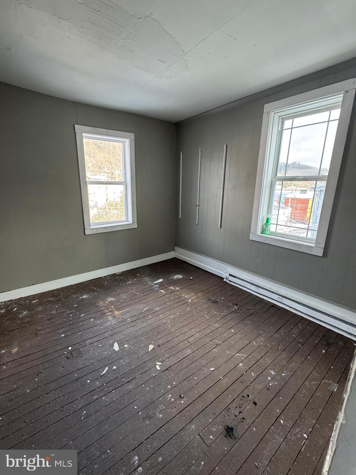 401 Walnut Street Ashland, PA 17921 - Photo 7 of 8 an empty room with wooden floor and windows