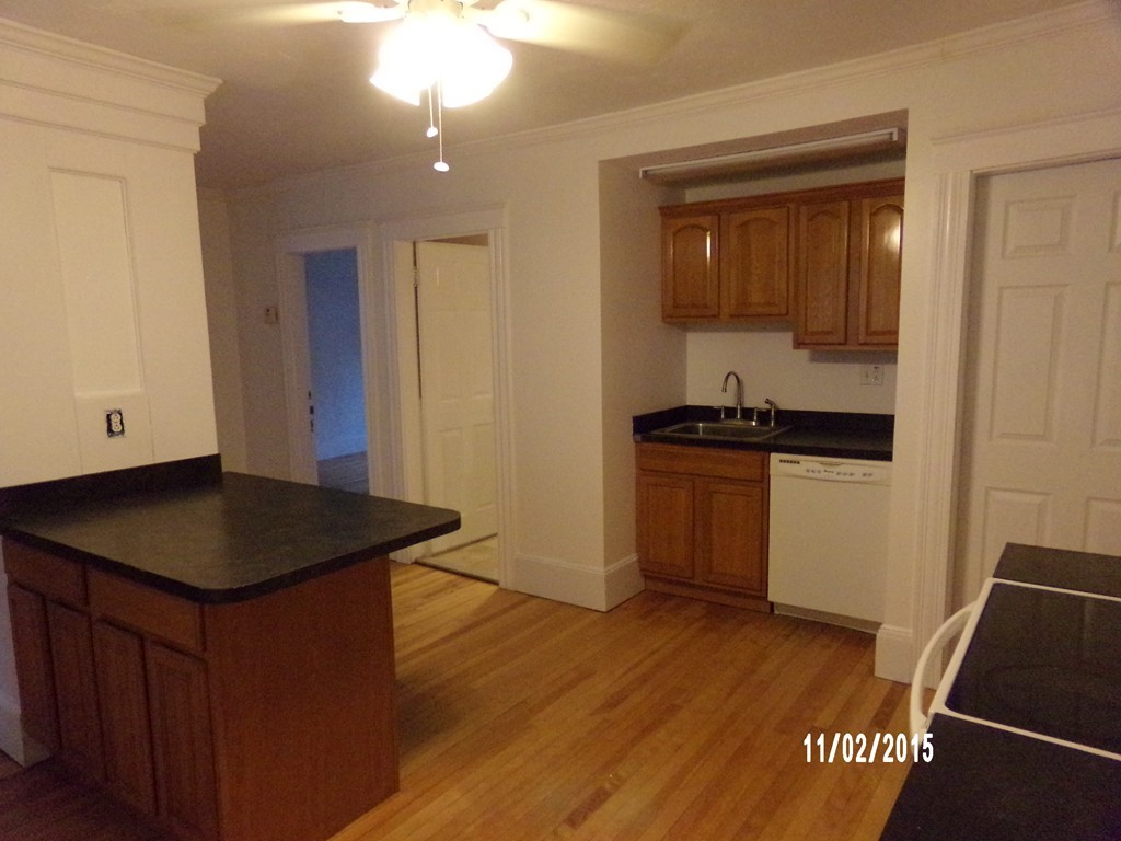 7 Dellwood Road Worcester, MA 01602 - Photo 16 of 19 a kitchen with a sink and a stove top oven