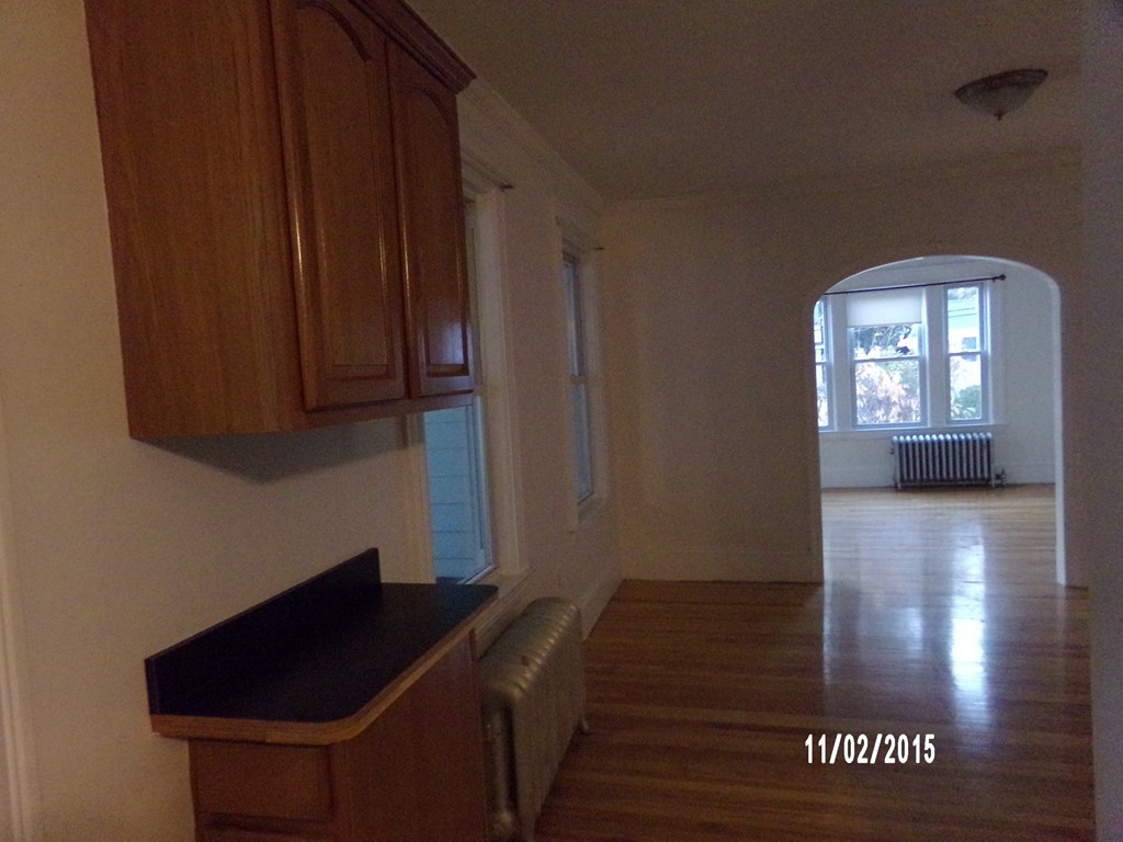 7 Dellwood Road Worcester, MA 01602 - Photo 19 of 19 a room with wooden floor and a chair